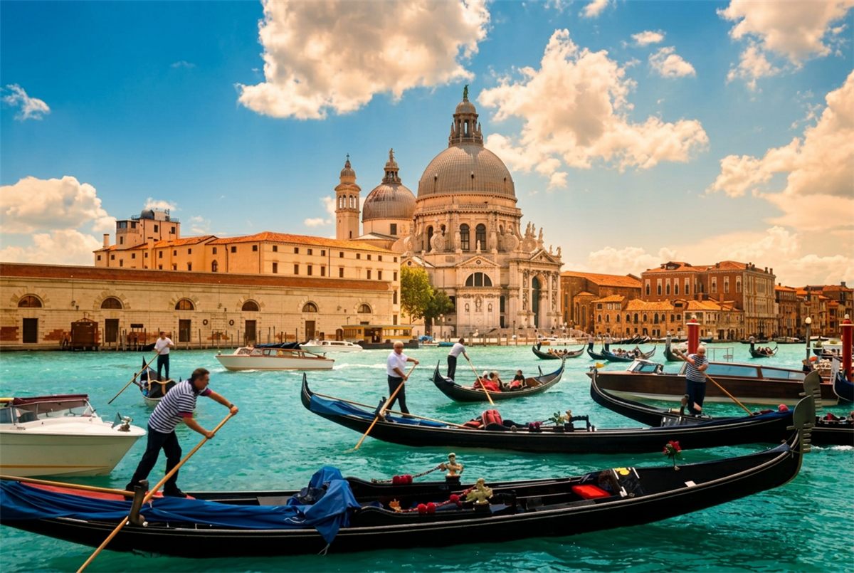 Gondolas on Venice's Grand Canal in front of the Santa Maria della Salute basilica on a bright sunny day